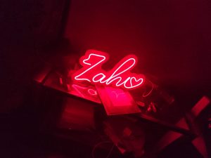"Express your affection with vibrant LED neon love stand prints."